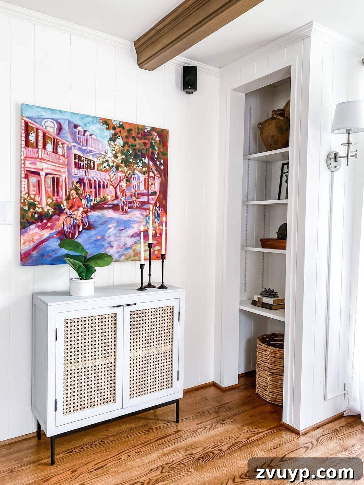 McNay Home Modern Coastal Living Revealed 16 Close-up of styled built-in shelves and an accent cabinet with a vibrant painting above