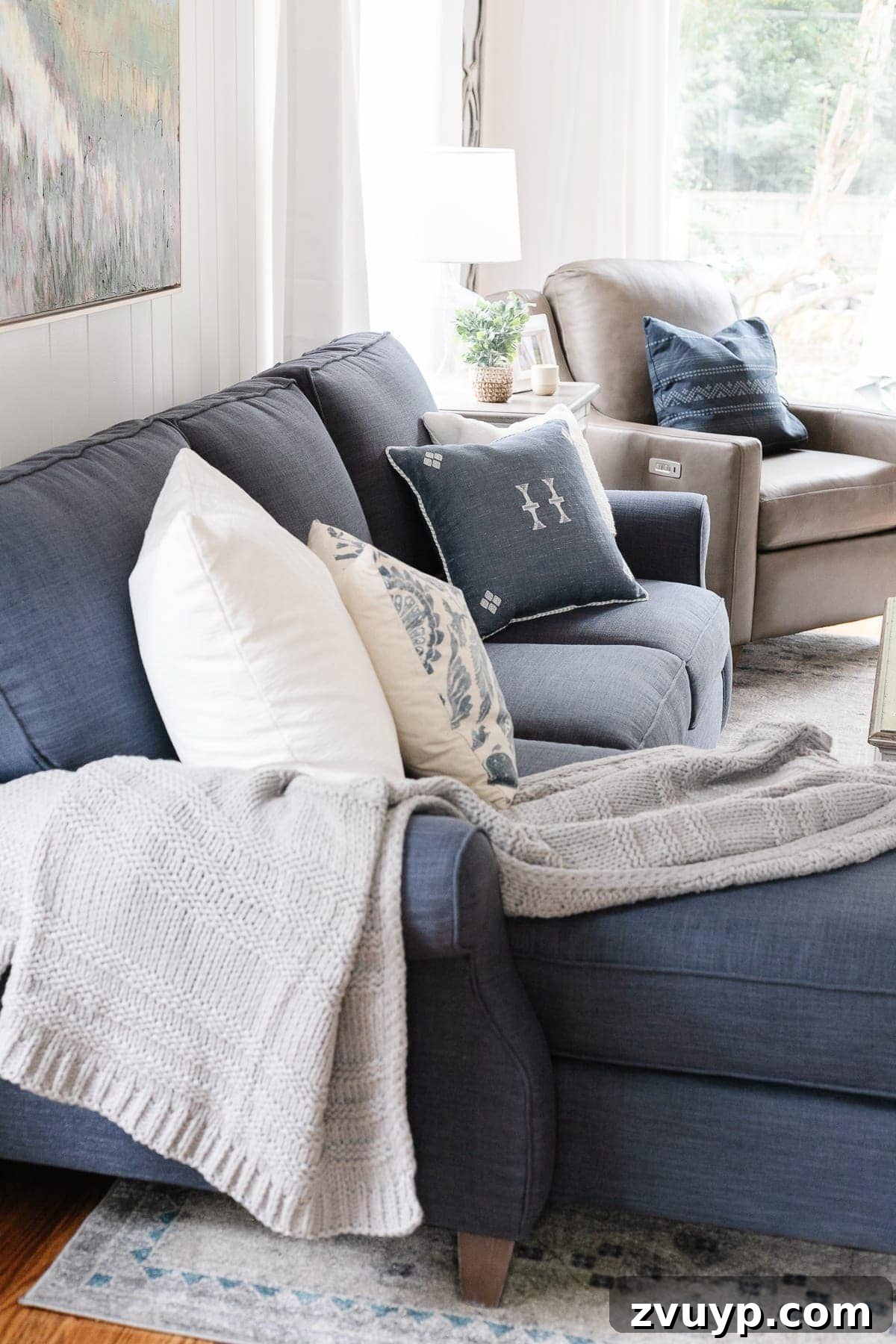 McNay Home Modern Coastal Living Revealed 9 Comfortable seating area featuring the Bassett sectional and a reading lamp