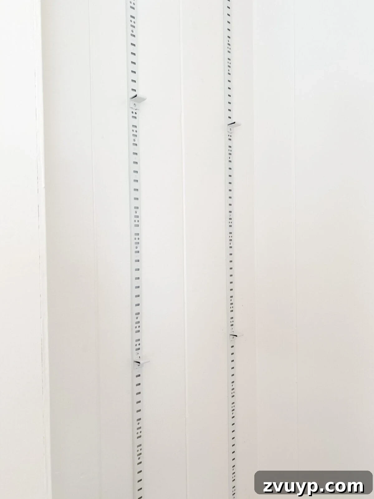 Transform Closets into Seamless Built-In Shelving 15 Close-up of built-in shelf brackets installed on pilaster strips