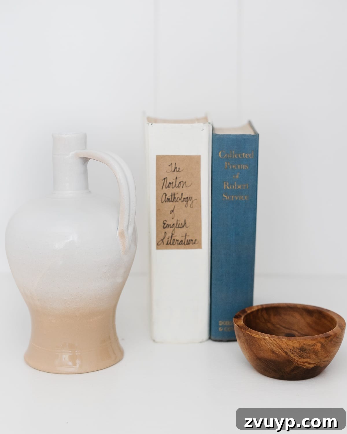 Transform Closets into Seamless Built-In Shelving 18 Close-up of rustic shelf decor with small vases and books