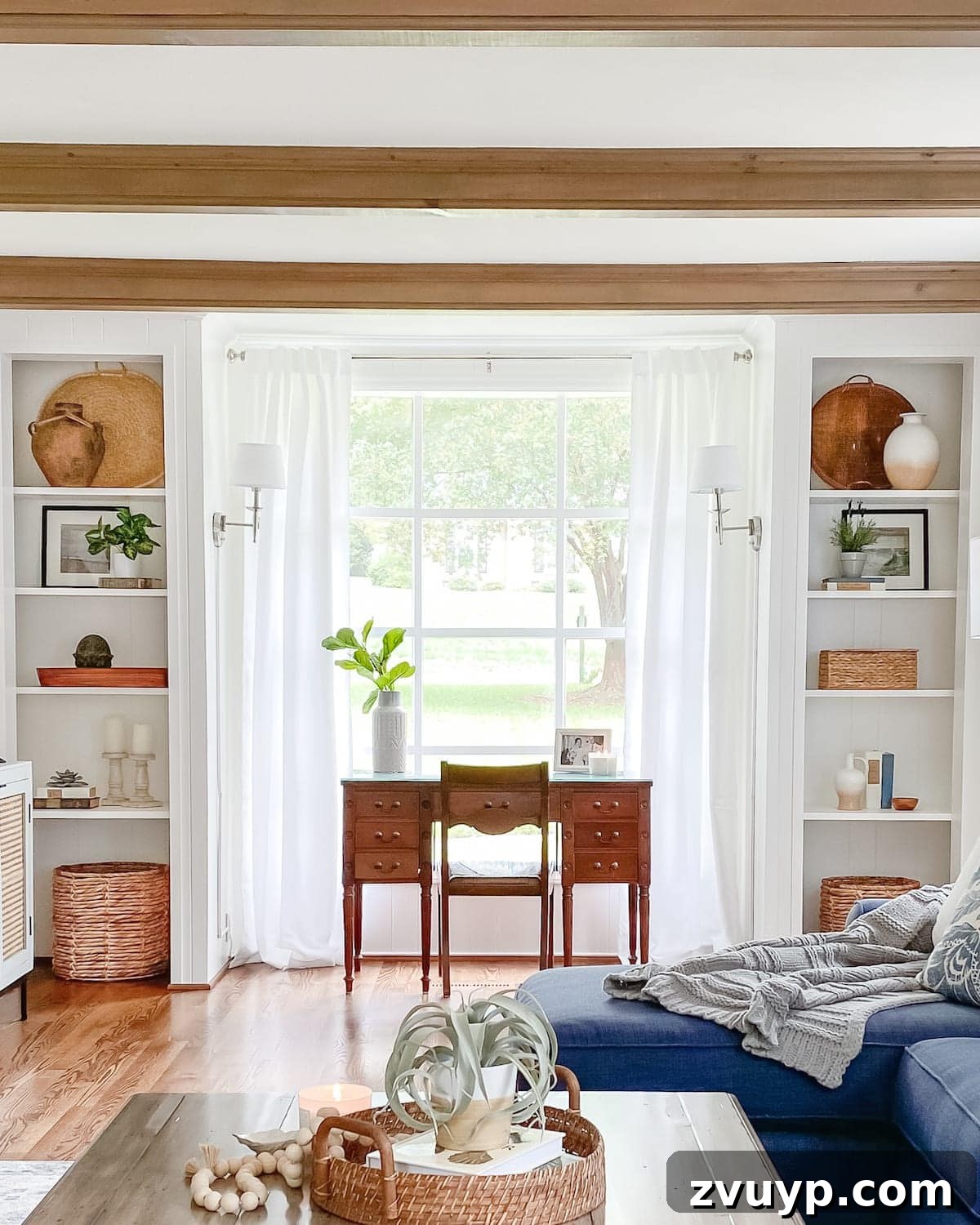 Transform Closets into Seamless Built-In Shelving 21 Living room office after conversion, featuring new built-in shelves and a fresh, modern aesthetic