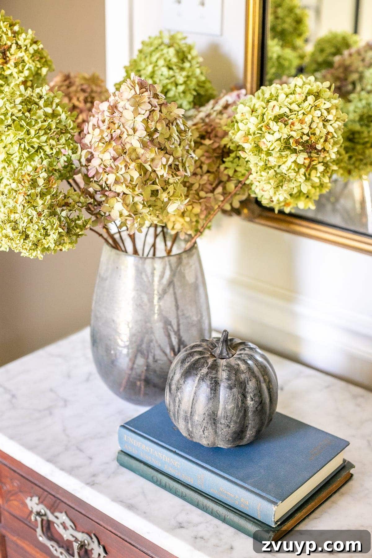 painted pumpkin with dried hydrangeas