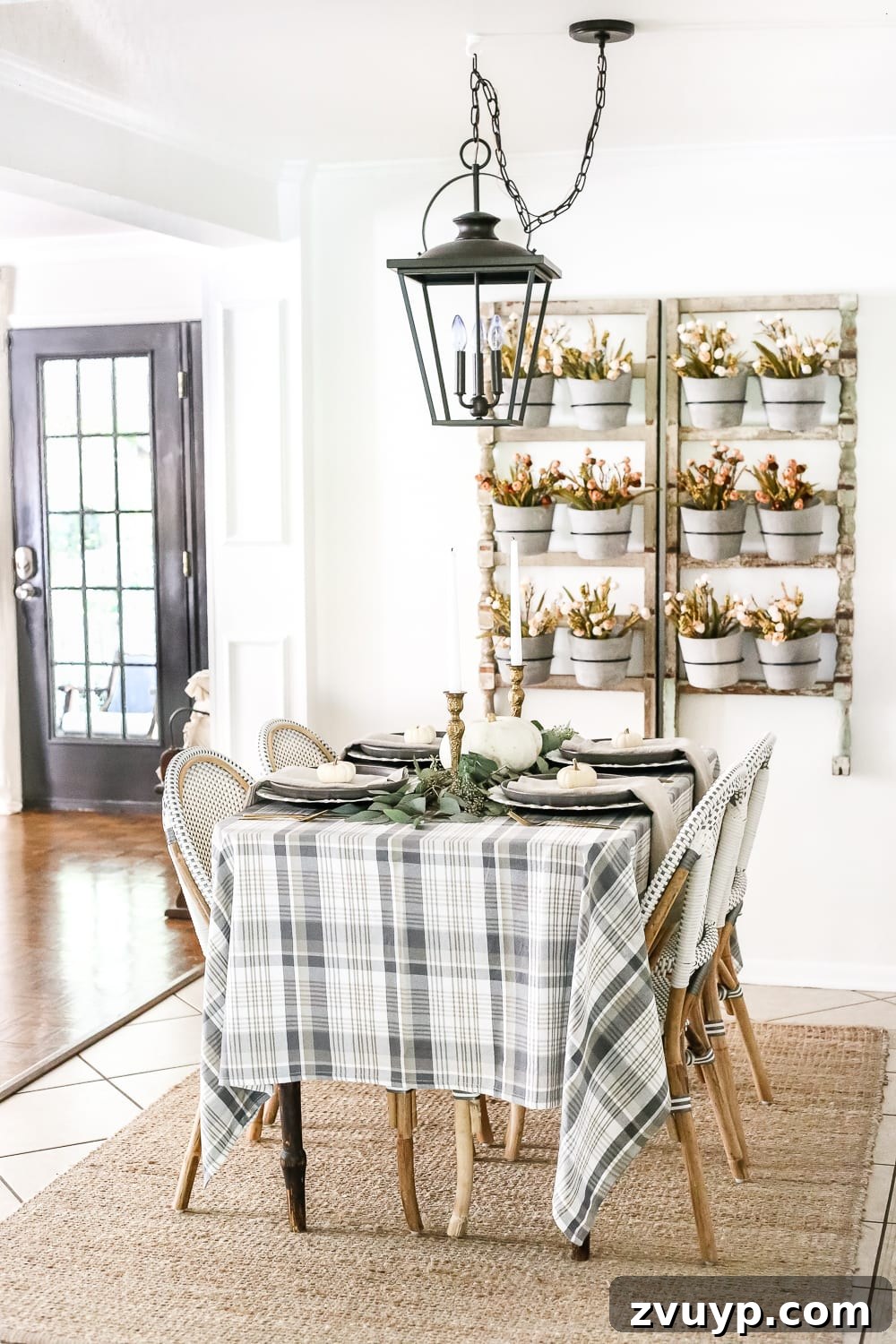 fall table with plaid tablecloth and wall planter