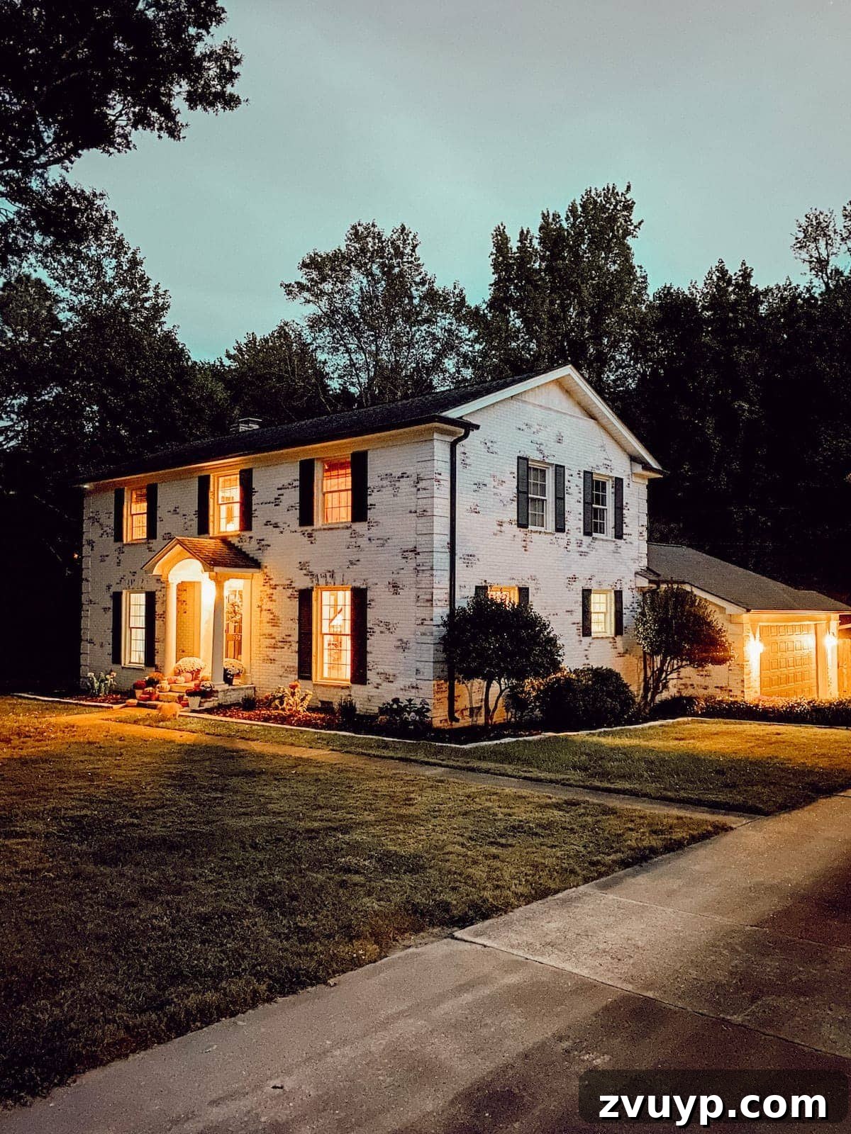 Autumn's Painted Porch 6 limewashed brick colonial house at night