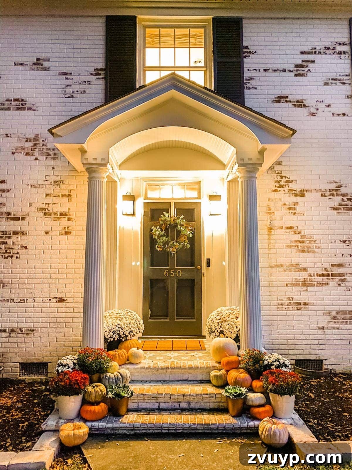 Autumn's Painted Porch 7 fall porch at night with pumpkins and mums and limewashed brick