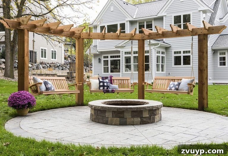 Elevate Your Outdoor Space: 15 Stunning Fire Pit Designs 15 Unique fire pit area featuring comfortable swings and an elegant pergola overhead.
