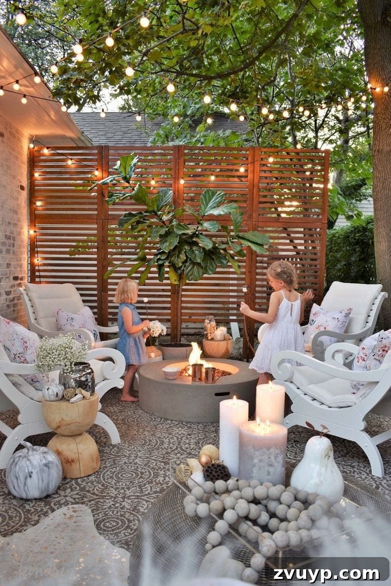 Elevate Your Outdoor Space: 15 Stunning Fire Pit Designs 5 Dreamy fire pit with string lights, wood screen, and limewashed brick, complemented by a stenciled patio.