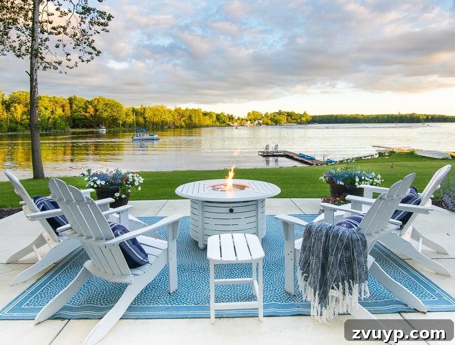 Elevate Your Outdoor Space: 15 Stunning Fire Pit Designs 8 Fire pit area positioned by a serene lake, offering stunning views.