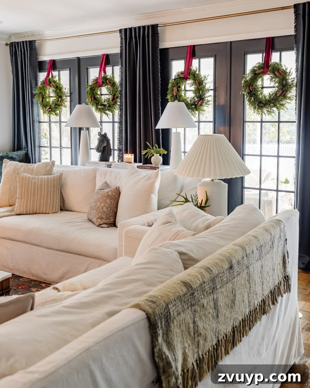 wreaths on windows for Christmas in a living room festive decor
