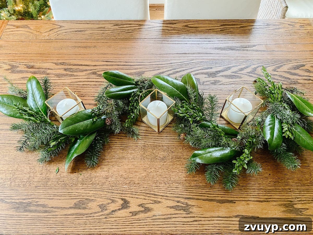 Crafting Natural Christmas Decor from Dried Fruit and Preserved Leaves 12 Layering boxwood stems and magnolia leaves onto an artificial garland for a rich, natural Christmas look