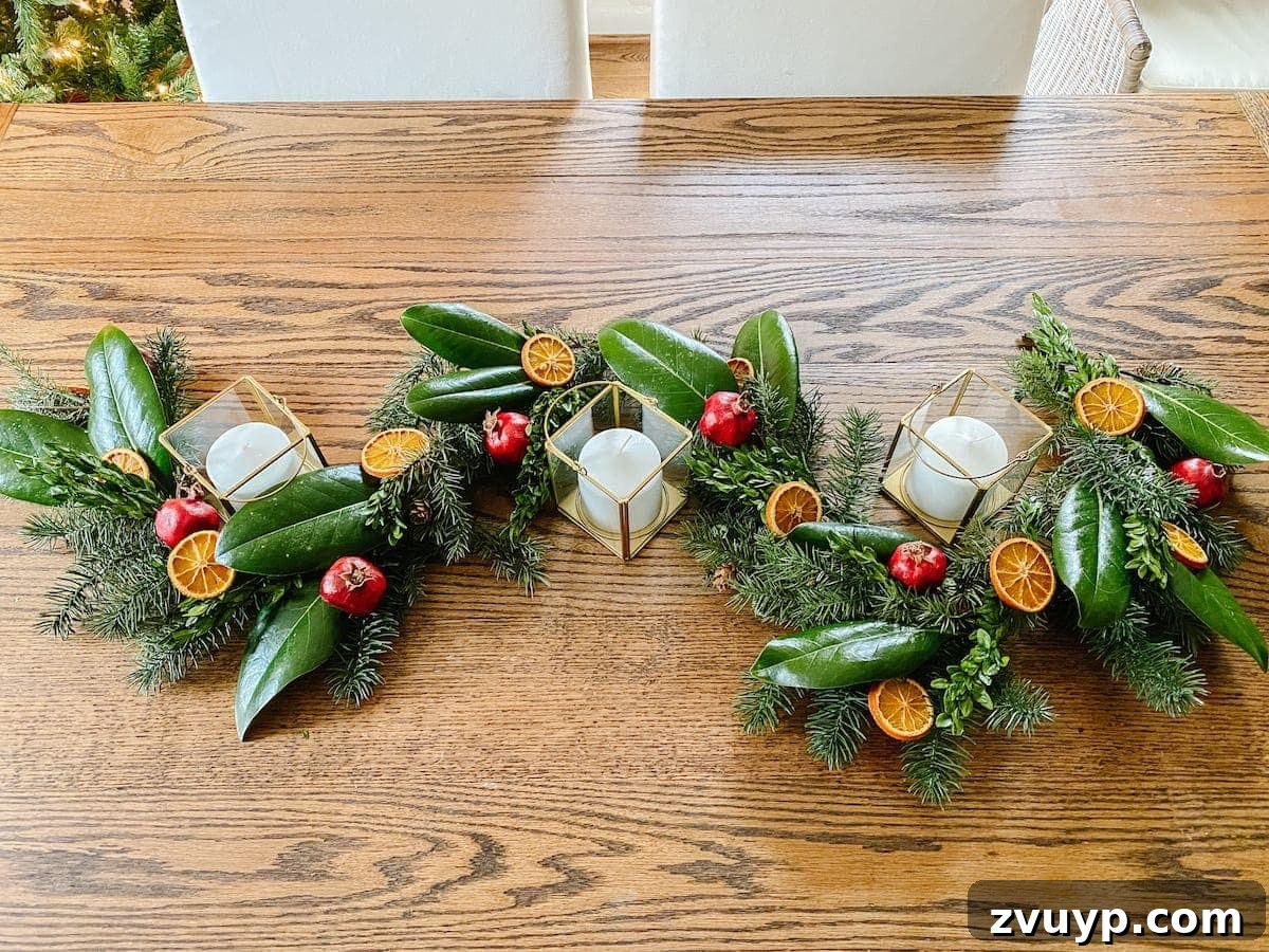 Crafting Natural Christmas Decor from Dried Fruit and Preserved Leaves 14 Completed Christmas garland centerpiece featuring magnolia, boxwoods, dried oranges, and dried pomegranates