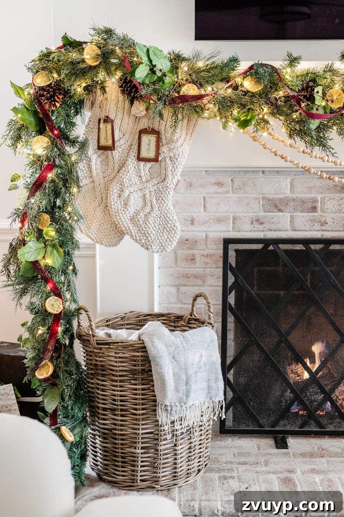 Crafting Natural Christmas Decor from Dried Fruit and Preserved Leaves 22 Christmas mantel garland featuring natural pine cones mixed with greenery