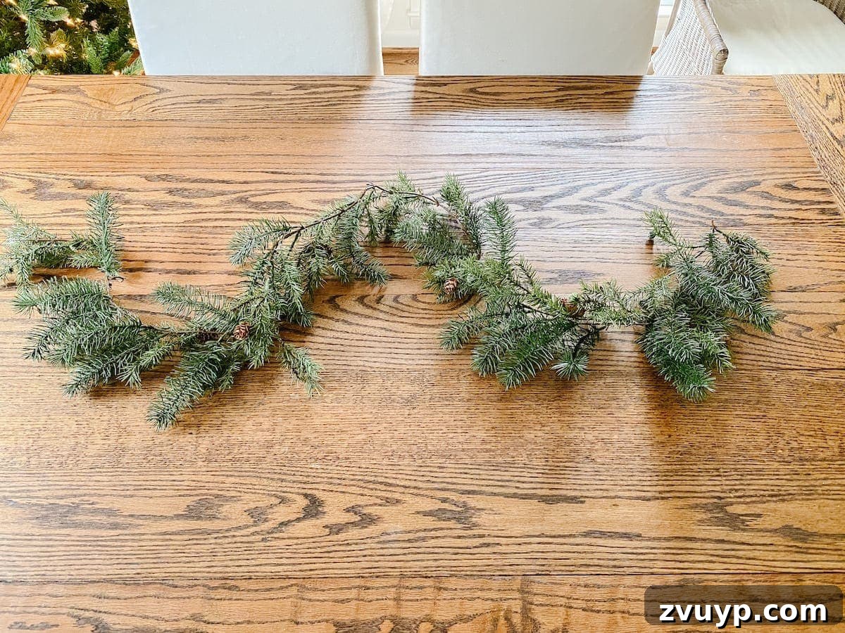 Crafting Natural Christmas Decor from Dried Fruit and Preserved Leaves 10 Starting with an artificial Christmas garland as the base for a natural centerpiece