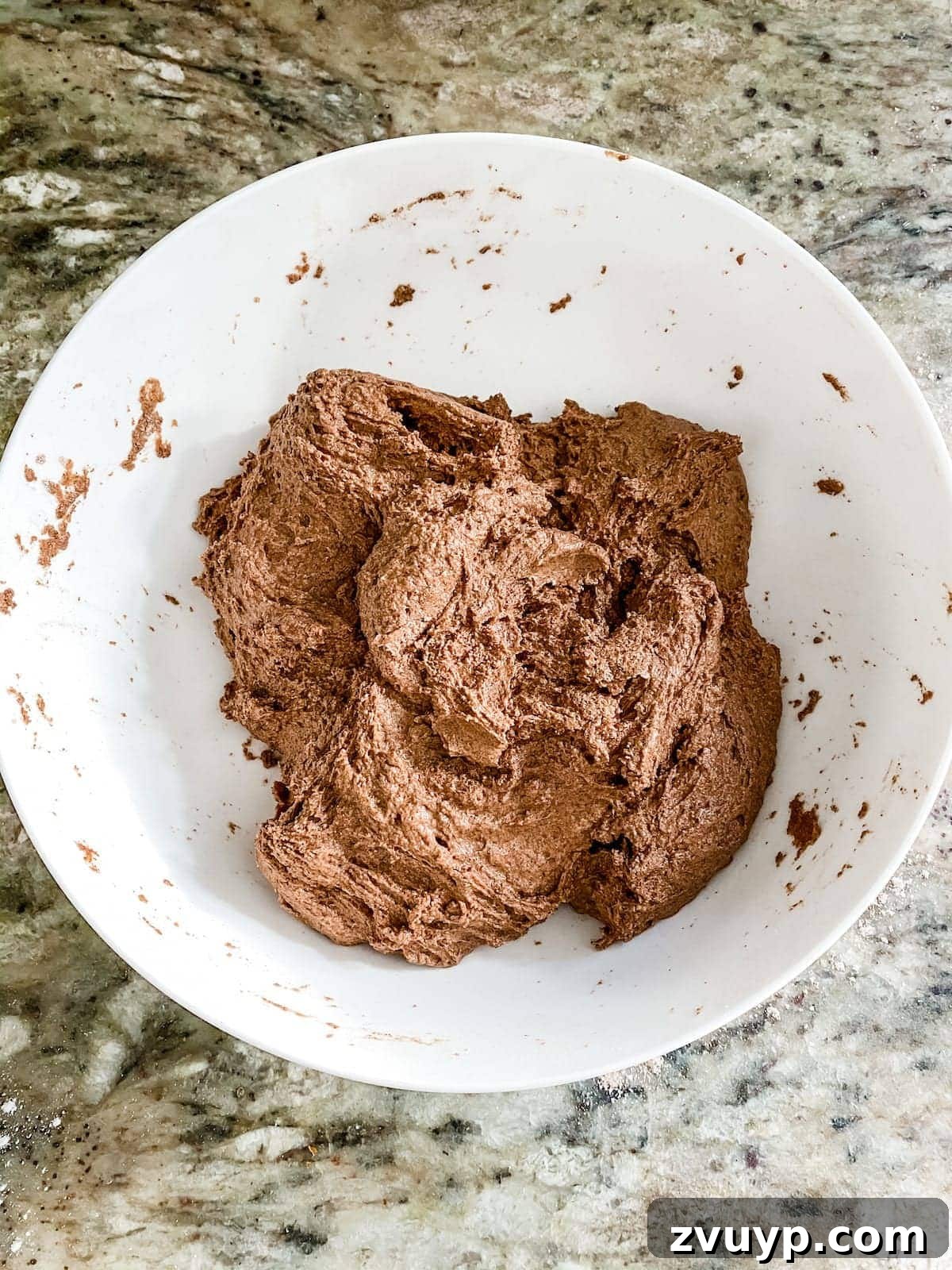 Craft Your Own Cinnamon Salt Dough Decorations 9 Mixing and kneading cinnamon salt dough to achieve a smooth, cookie-like consistency. The dough fills the air with a festive Christmas scent.