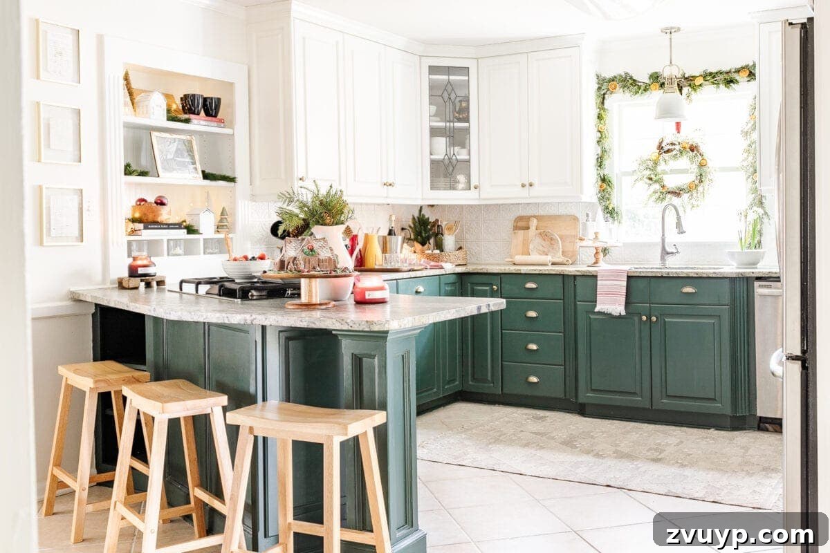 green and white kitchen decorated for Christmas with a wreath on the window