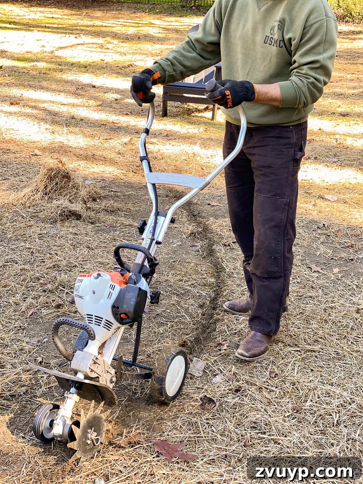 Weekend Wonder: DIY Pea Gravel Fire Pit 14 Close-up of the STIHL Yard Boss in action, defining the edge of the fire pit area.