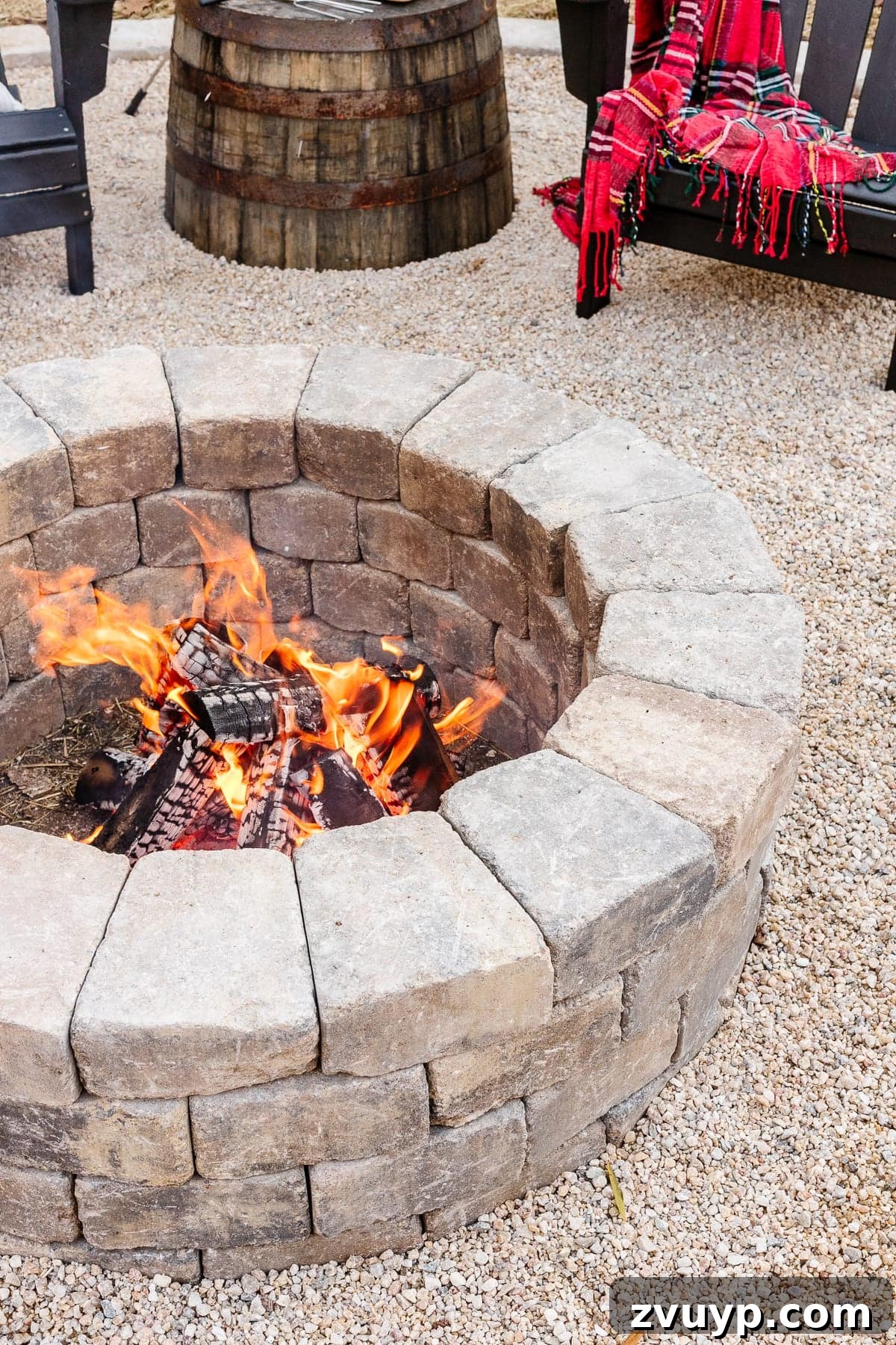 Weekend Wonder: DIY Pea Gravel Fire Pit 19 A finished stone DIY backyard fire pit with pea gravel and comfortable Adirondack chairs, ready for enjoyment.