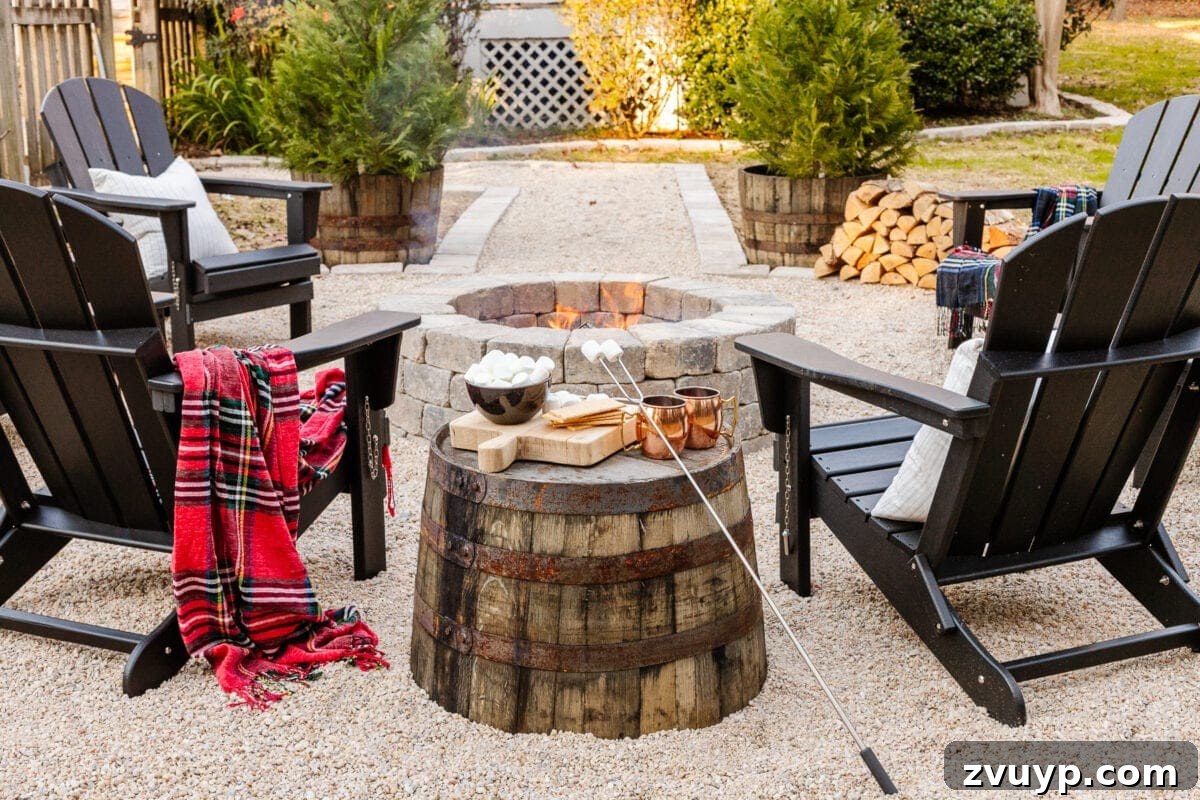 Weekend Wonder: DIY Pea Gravel Fire Pit 28 A stone DIY fire pit with pea gravel, stone edgers, and Adirondack chairs, featuring a barrel planter as a practical side table.