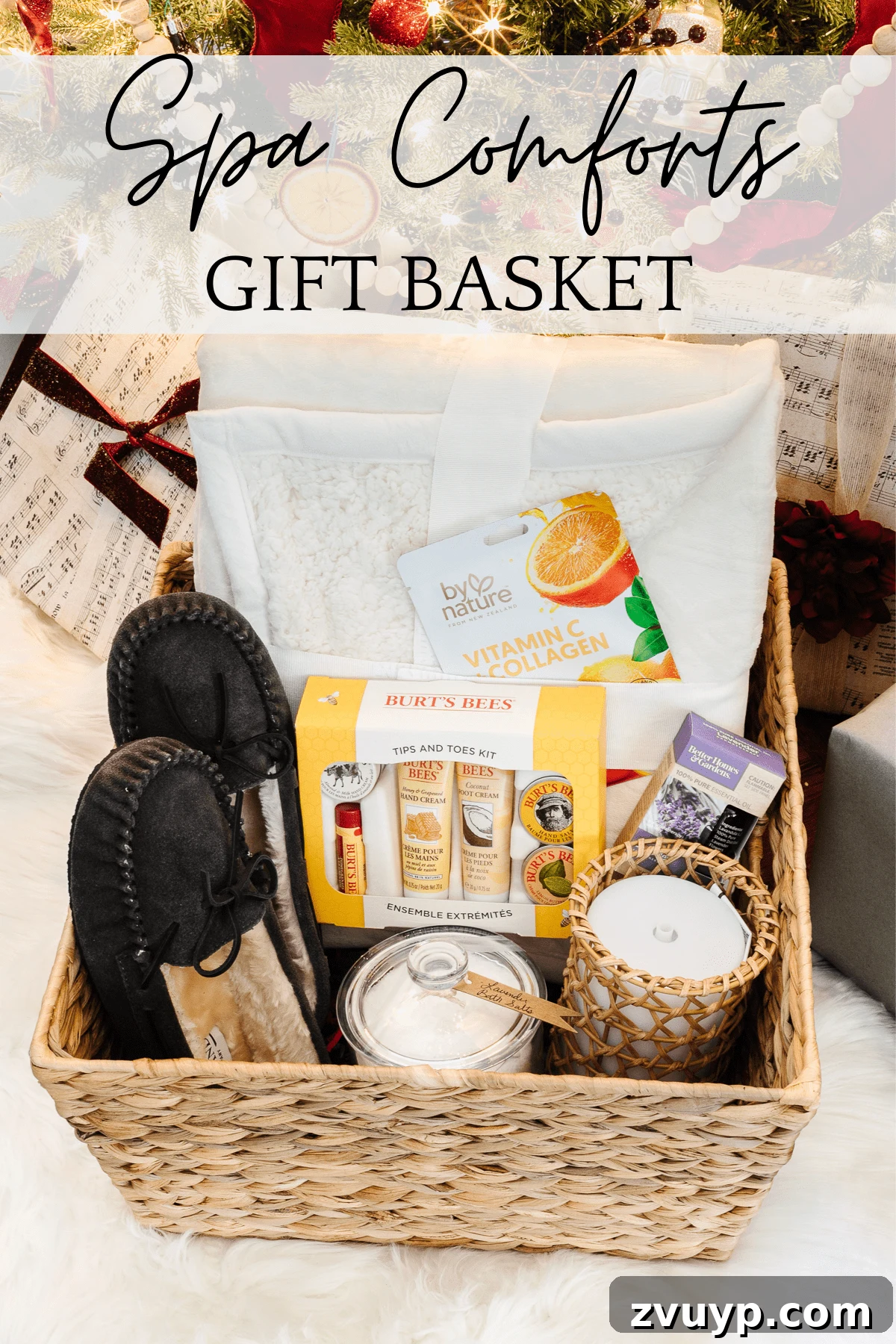 50 Festive Hamper Inspirations 8 Spa Gift Set with a throw blanket, slippers, essential oil diffuser, essential oil, apothecary jar with bath salts, hand and foot set, and a facial mask.