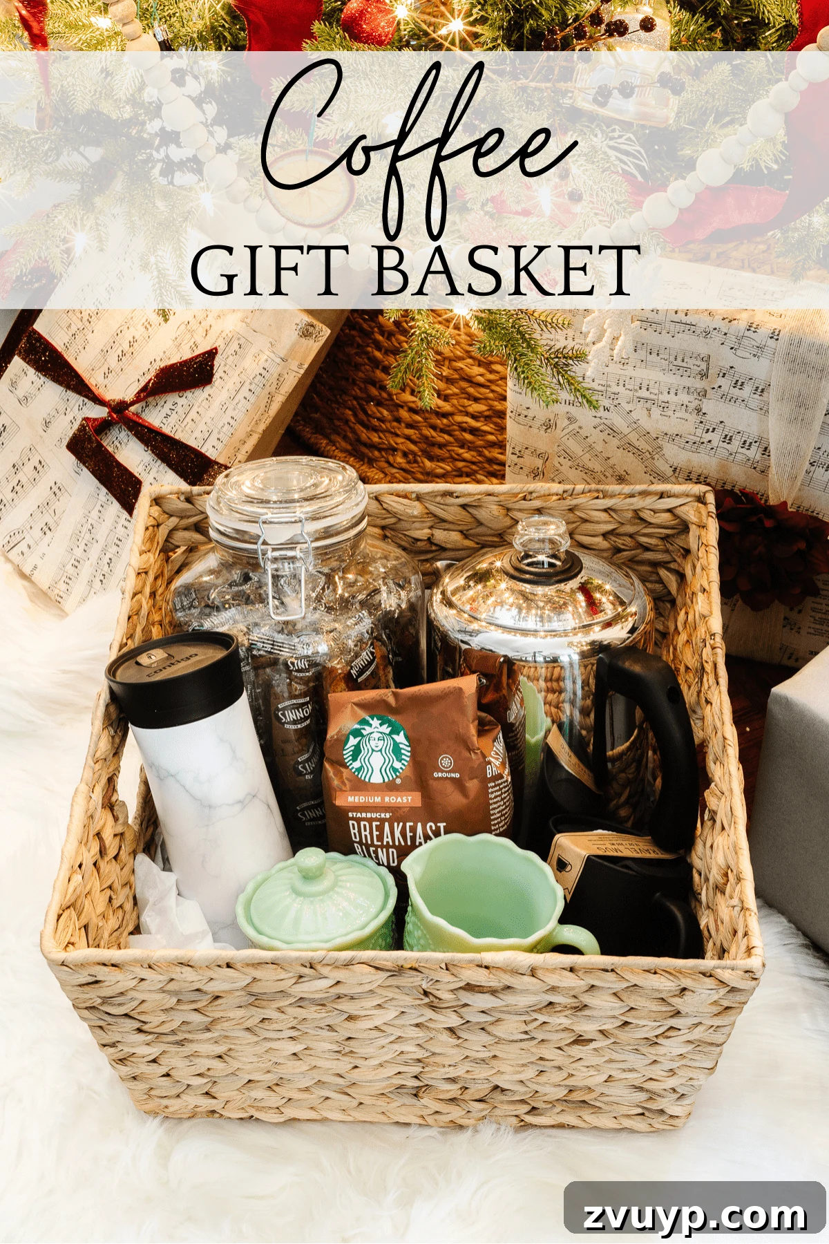 50 Festive Hamper Inspirations 5 Coffee Gift Basket with a percolator, coffee beans, biscotti, sugar and creamer set, and travel mugs.