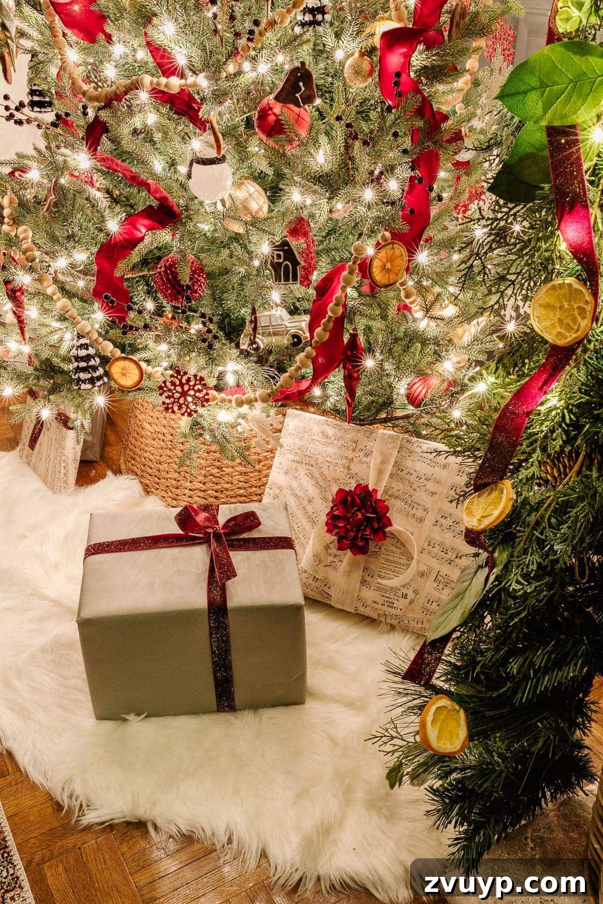The 2020 Candlelit Yuletide Journey 17 Christmas tree sparkling with warm lights in a dark room