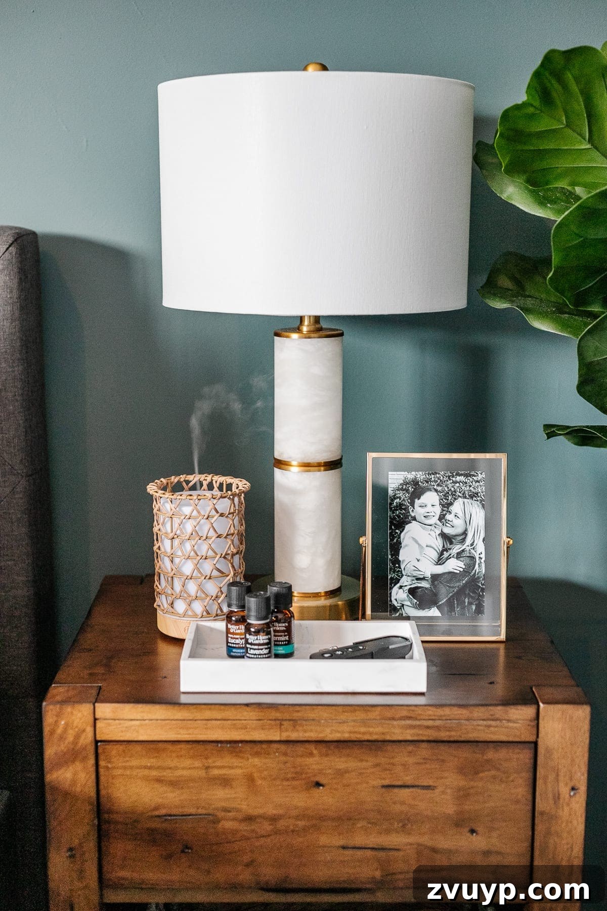 Crafting a Spa Sanctuary: Bedroom Decor for Ultimate Serenity 13 Marble and gold lamp on a wooden nightstand in a teal bedroom