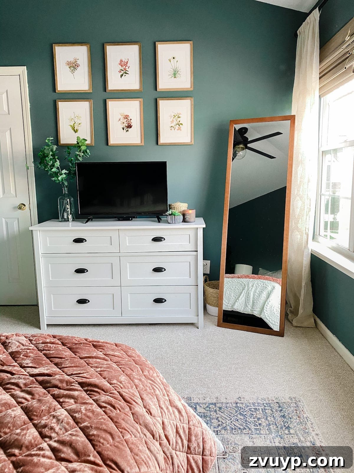 Crafting a Spa Sanctuary: Bedroom Decor for Ultimate Serenity 18 Bedroom with TV hidden behind botanical art prints in blush and teal tones