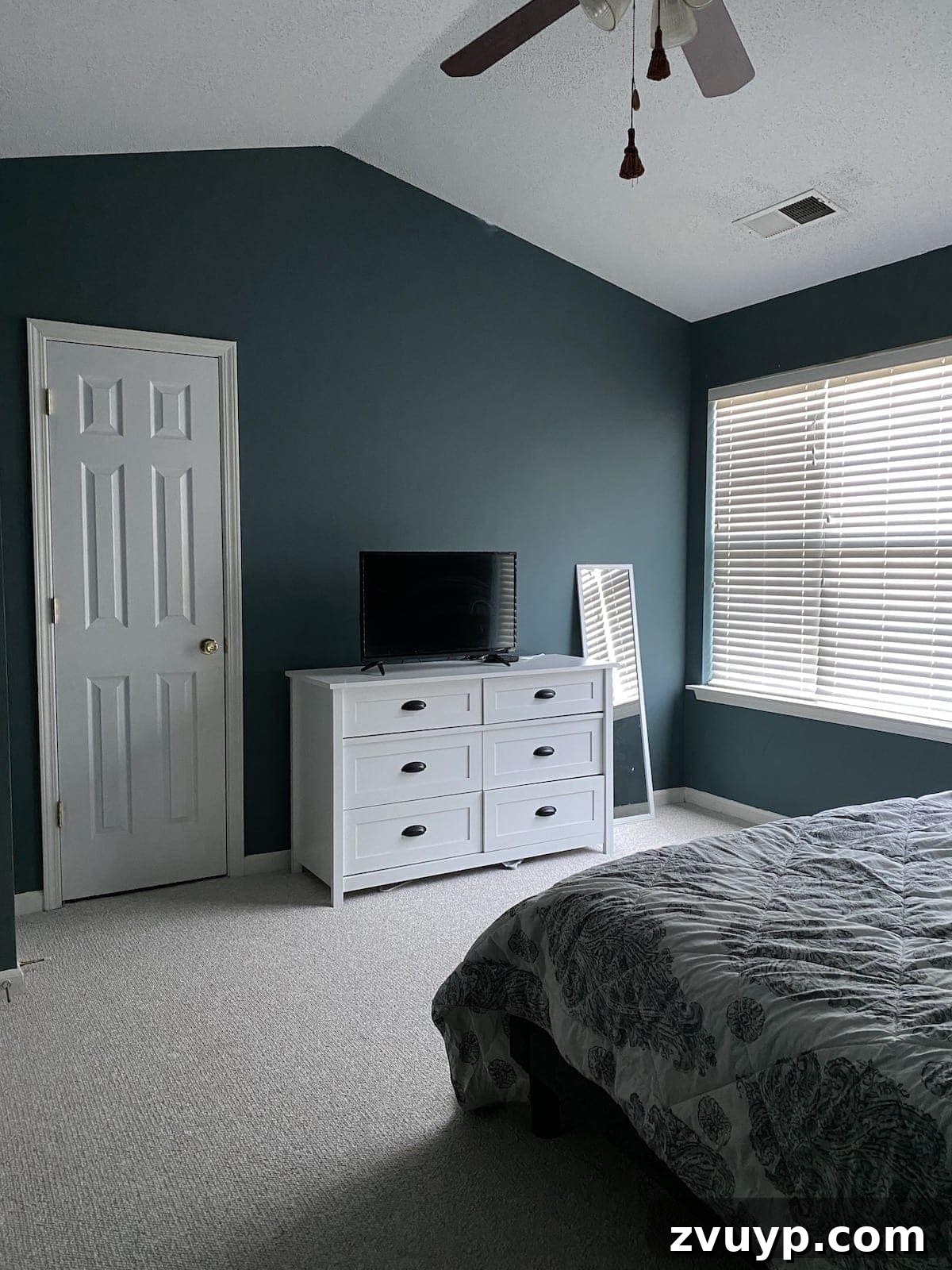 Crafting a Spa Sanctuary: Bedroom Decor for Ultimate Serenity 4 Another before photo of the teal bedroom with basic decor