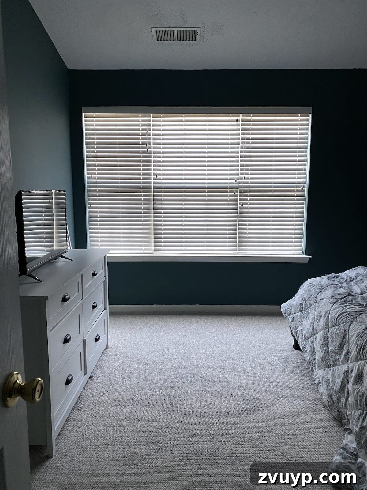 Crafting a Spa Sanctuary: Bedroom Decor for Ultimate Serenity 6 Before photo of the bedroom showcasing closed blinds and lack of natural light