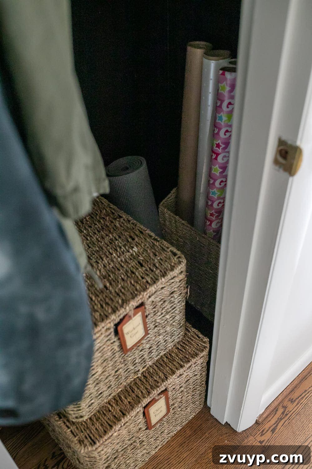 Smart Organization Solutions for a Clutter Free Home 17 Baskets for organizing workout gear and gift wrap supplies inside a functional coat closet.