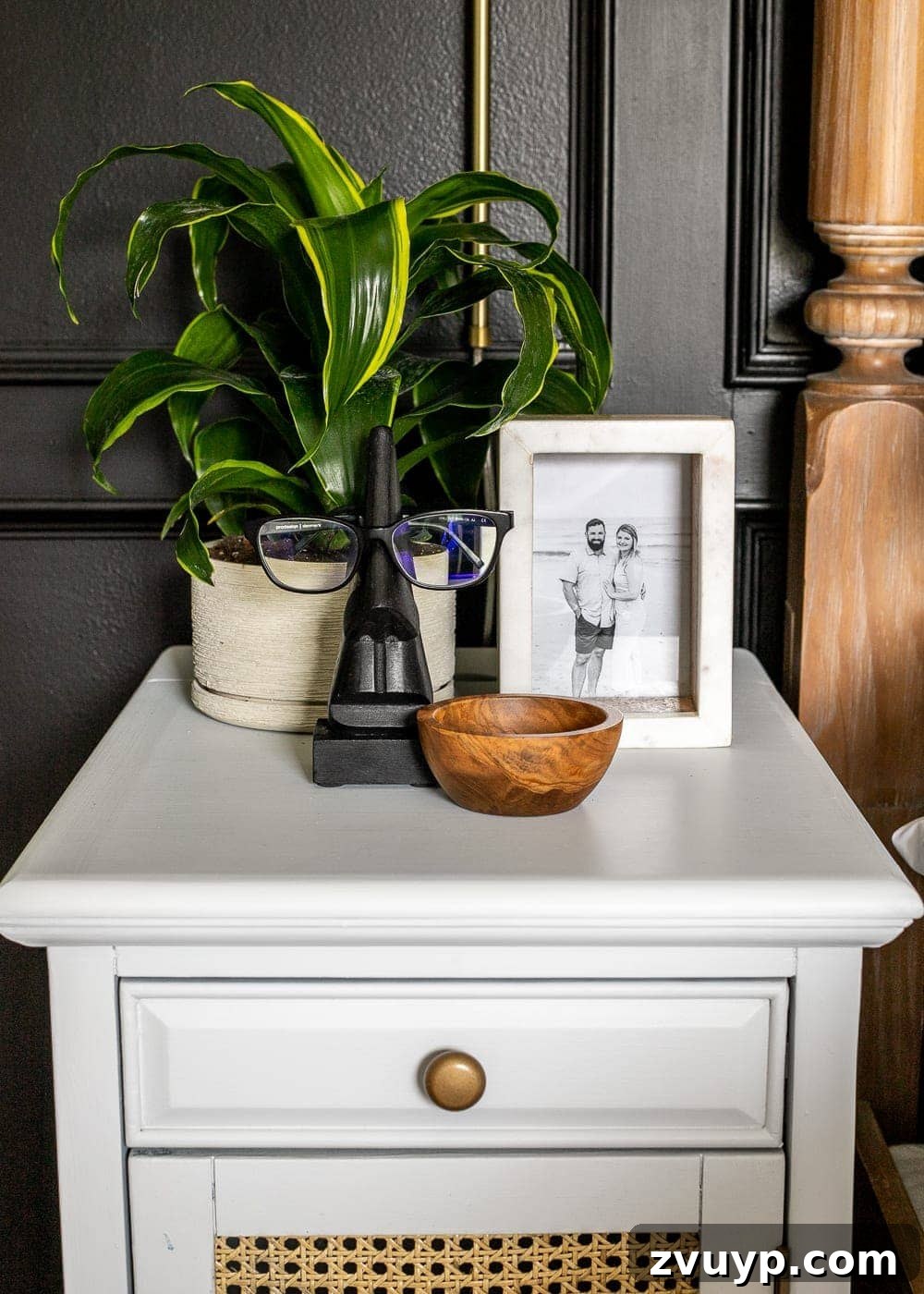 Smart Organization Solutions for a Clutter Free Home 22 A nightstand featuring an eyeglass holder and a small trinket bowl for organizing personal items.