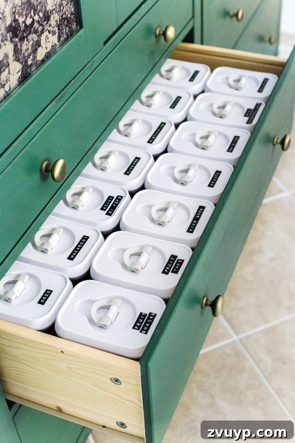 Smart Organization Solutions for a Clutter Free Home 25 Labeled clear containers neatly arranged in a pantry drawer, demonstrating efficient and visible storage.