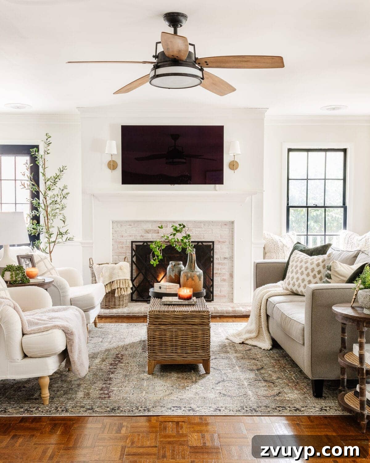 Seasonal Snuggle Spot My Favorite Winter Decor 2 A warm and cozy winter living room featuring a fireplace, comfortable seating, and soft lighting, ideal for year-round ambiance.