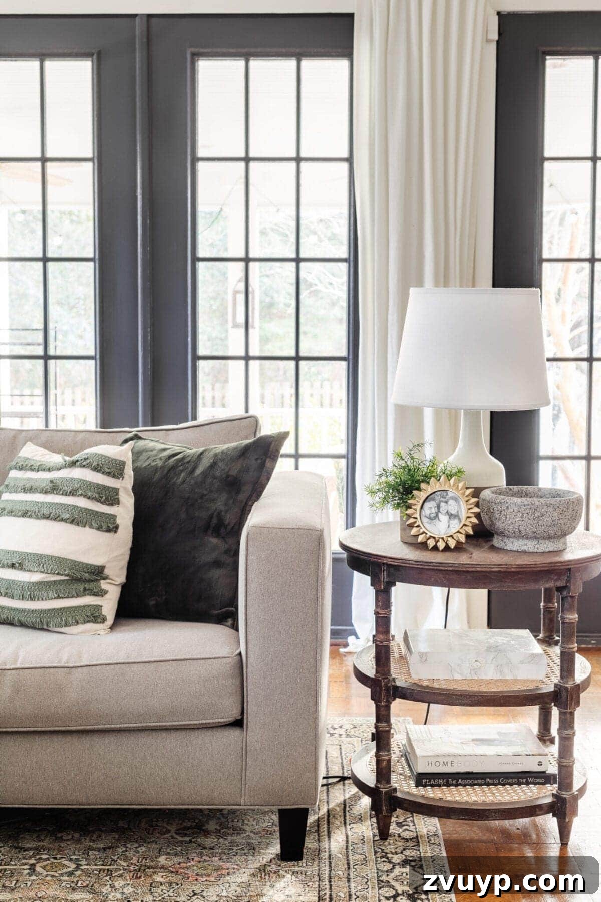 Seasonal Snuggle Spot My Favorite Winter Decor 9 A warm winter living room featuring a comfortable sofa, cozy textiles, and natural light.