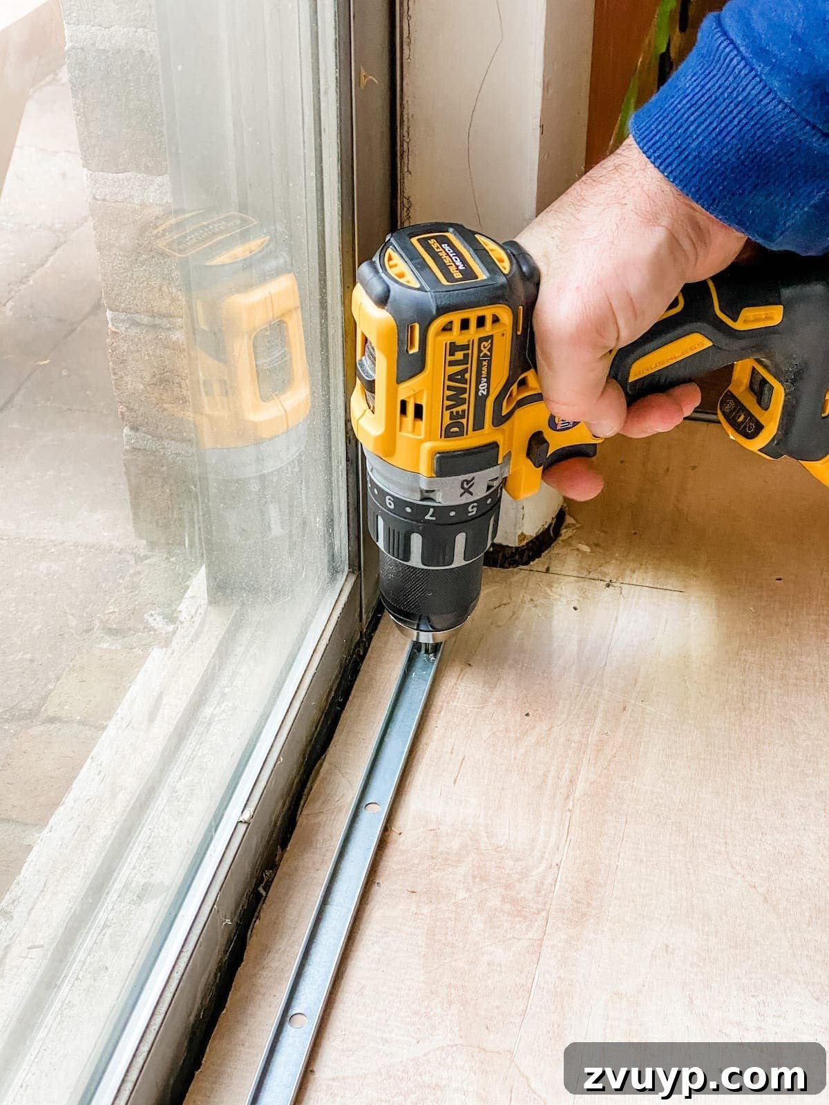 setting a threshold for luxury vinyl plank flooring with a metal track