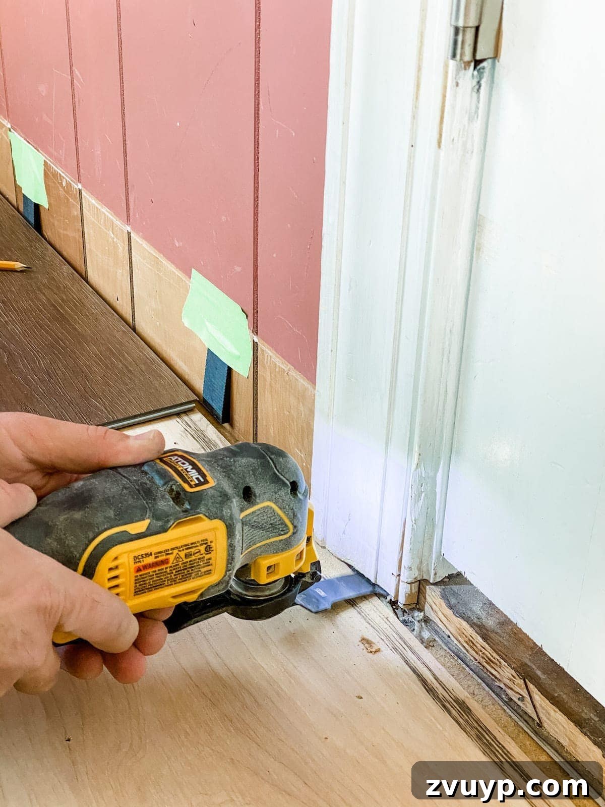 close-up of undercutting door jambs for luxury vinyl plank flooring