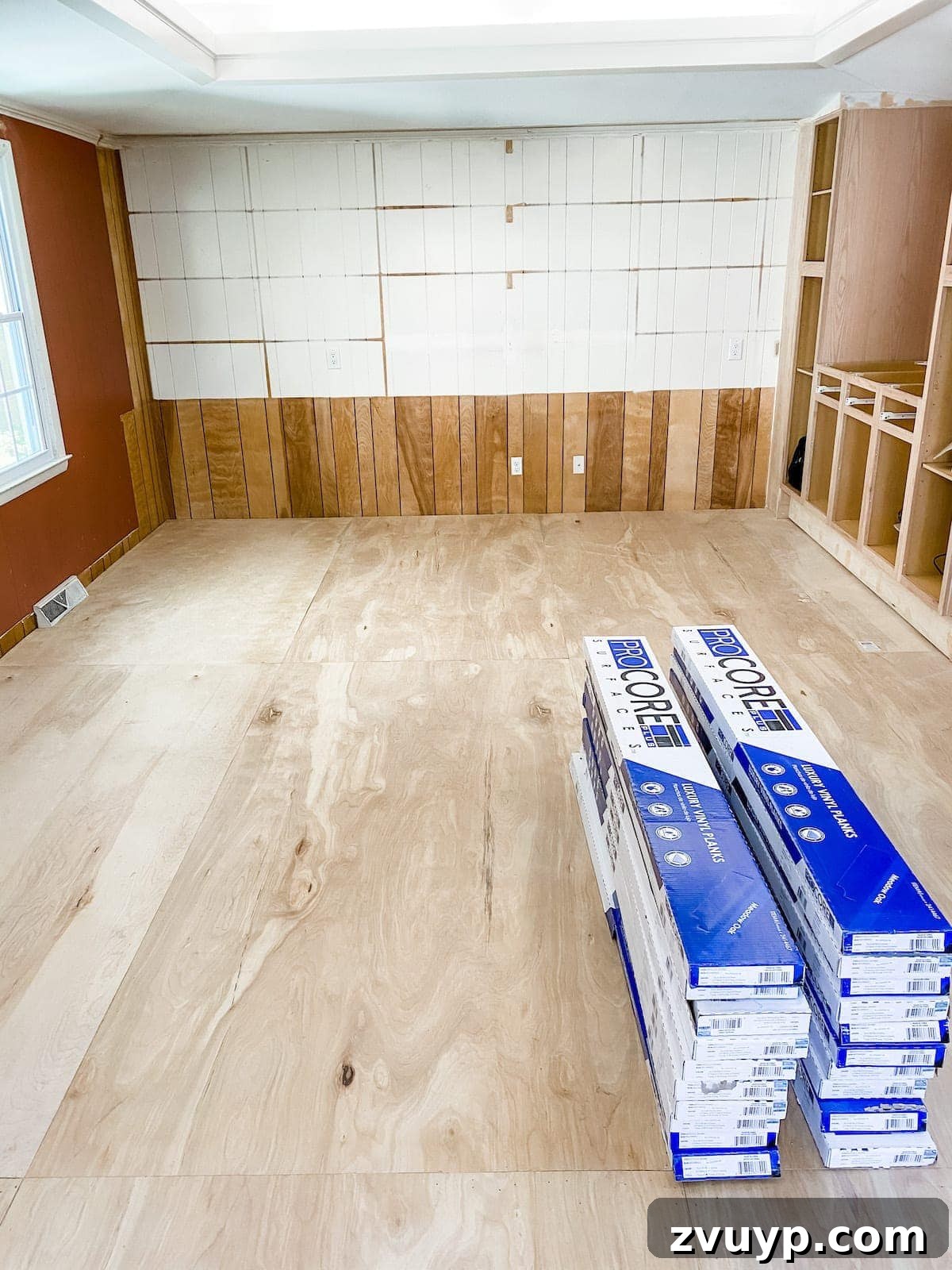 LVP flooring planks acclimating in a room prior to installation