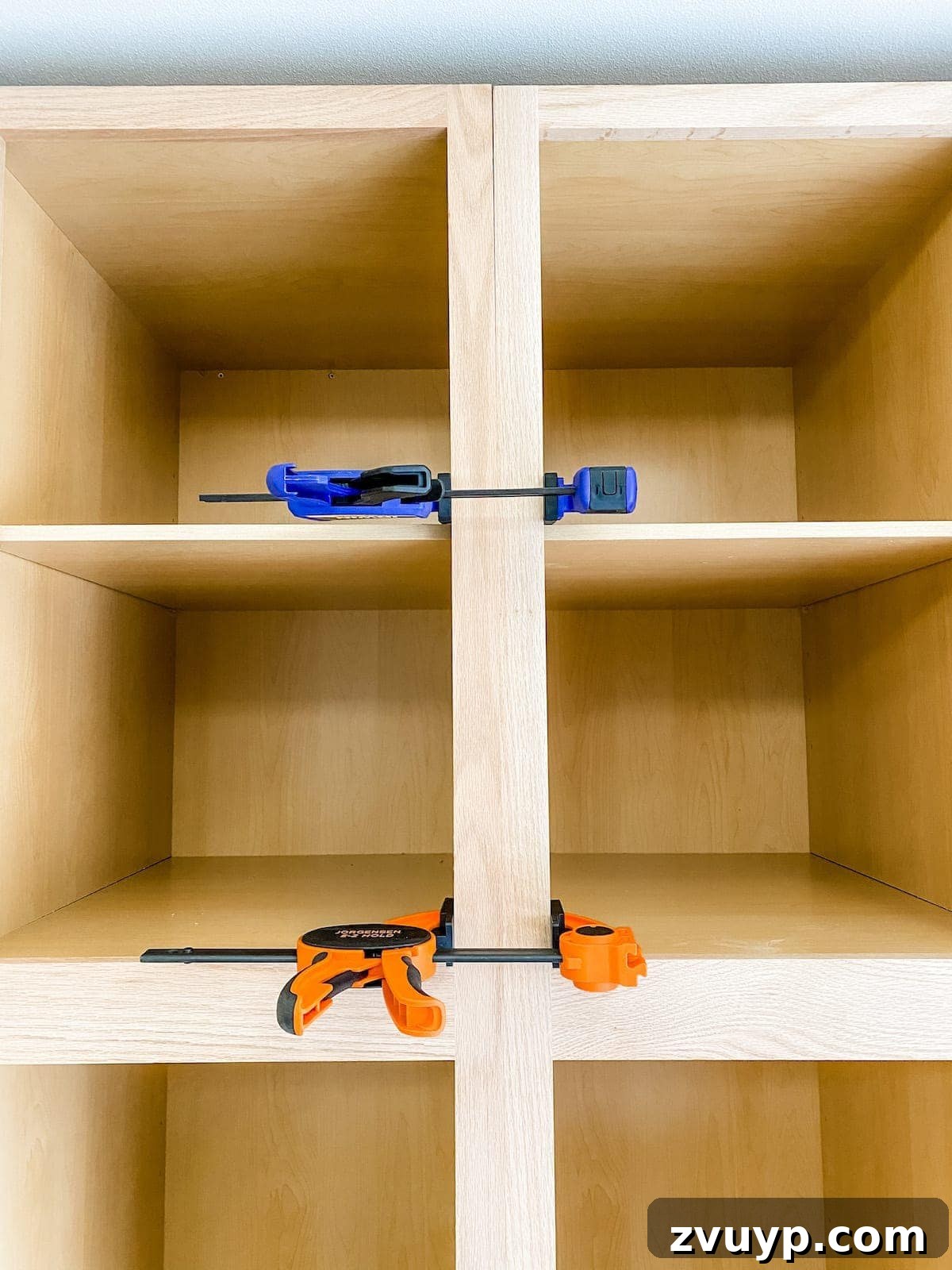 DIY Custom Built-In Storage and Window Nook 24 No visible gap between two adjacent stock cabinet frames after clamping and screwing them together