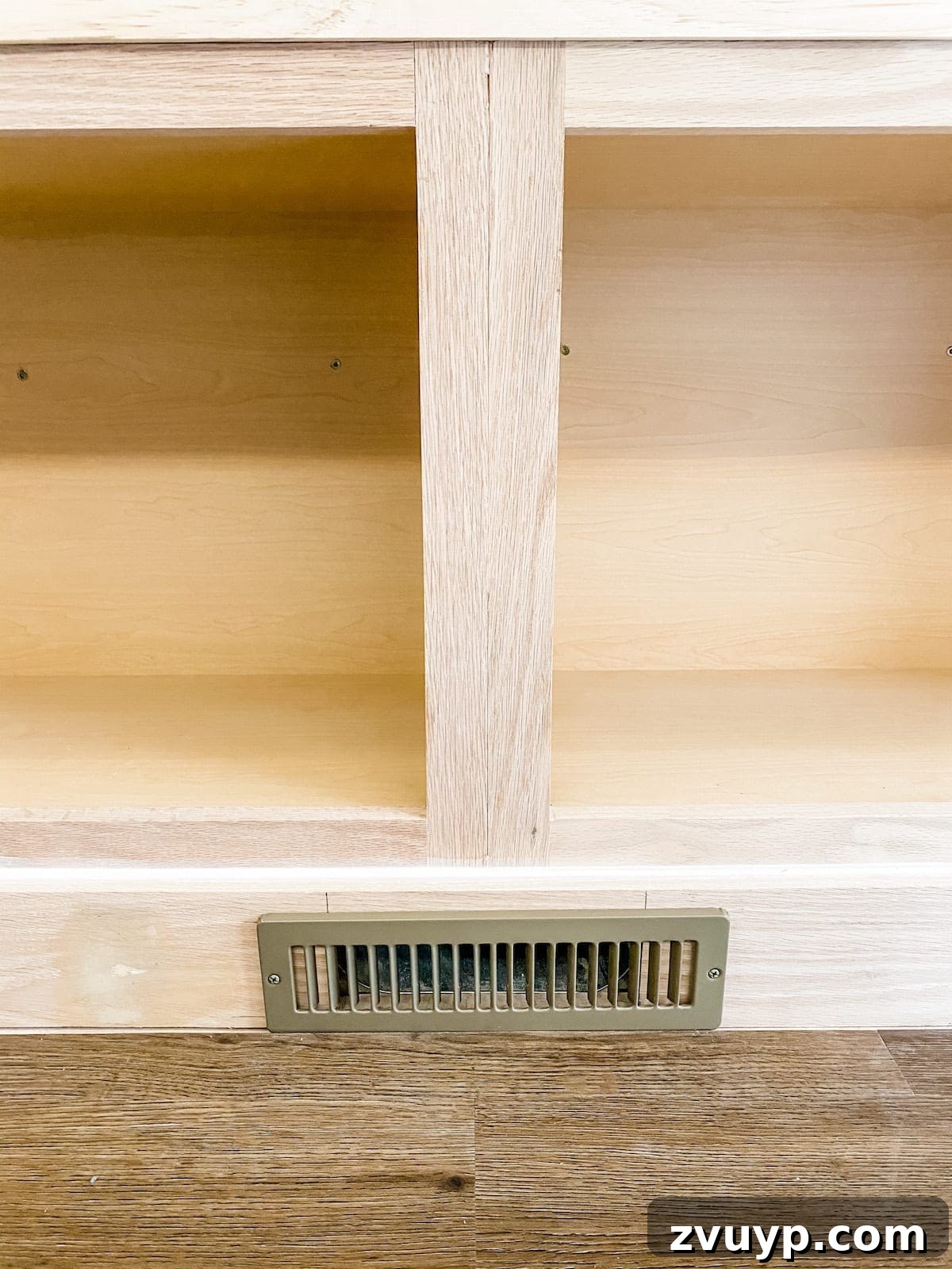 DIY Custom Built-In Storage and Window Nook 34 Close-up of a completed toe kick with an installed vent cover