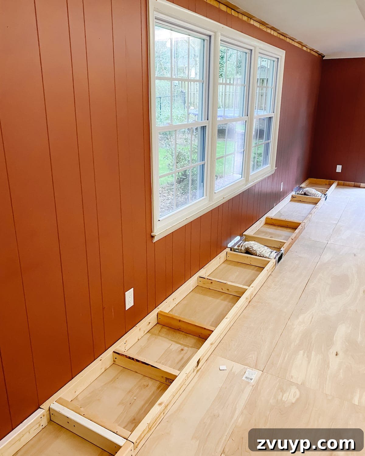 DIY Custom Built-In Storage and Window Nook 7 Framework of 2x4s forming the base for the DIY built-in cabinets and window seat
