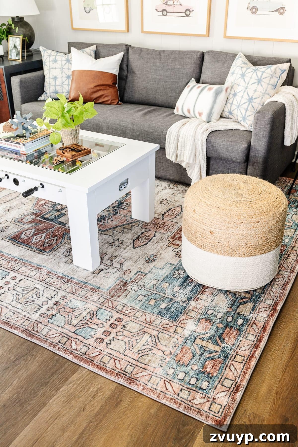 From Drab to Dream Den: Our Rec Room's Big Reveal 13 Rec room with jute poufs and colorful throw pillows on the sofa