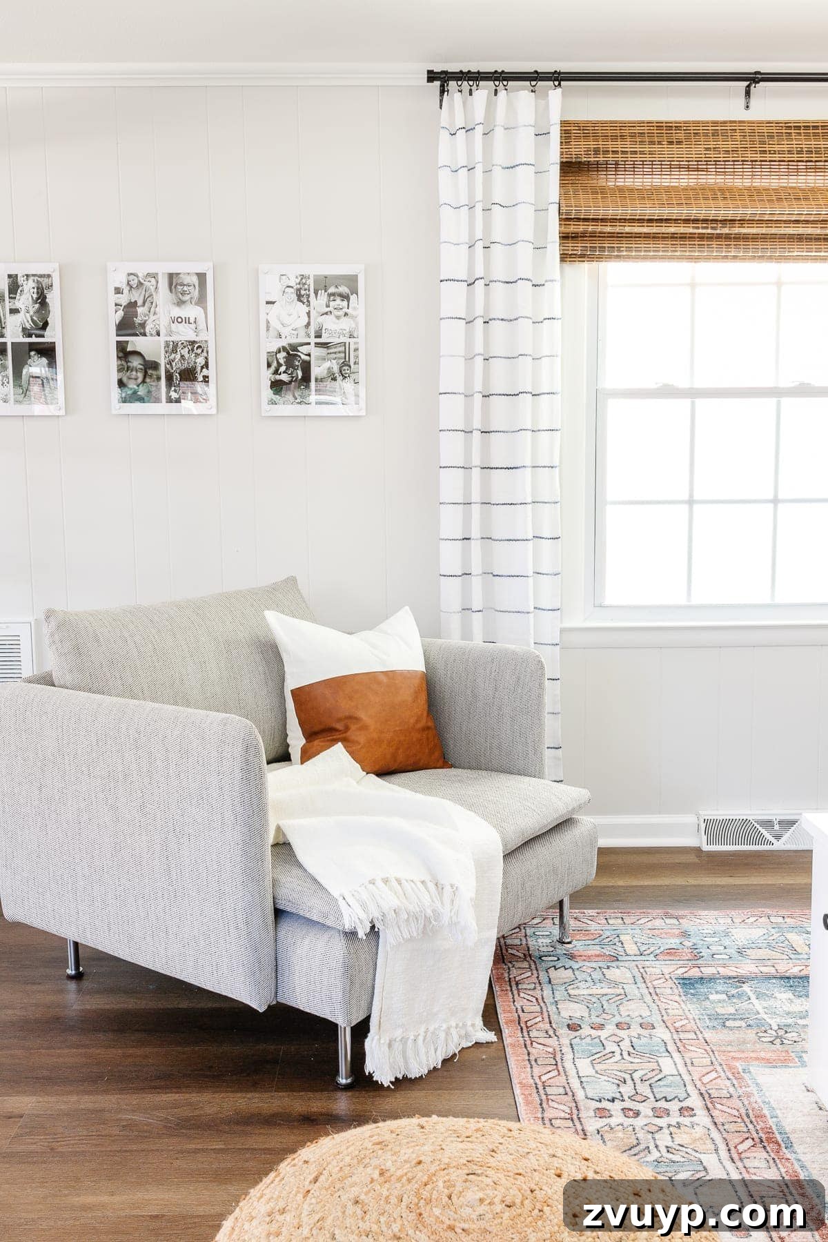 From Drab to Dream Den: Our Rec Room's Big Reveal 15 Cozy chair and a half with throw pillows and a floor lamp