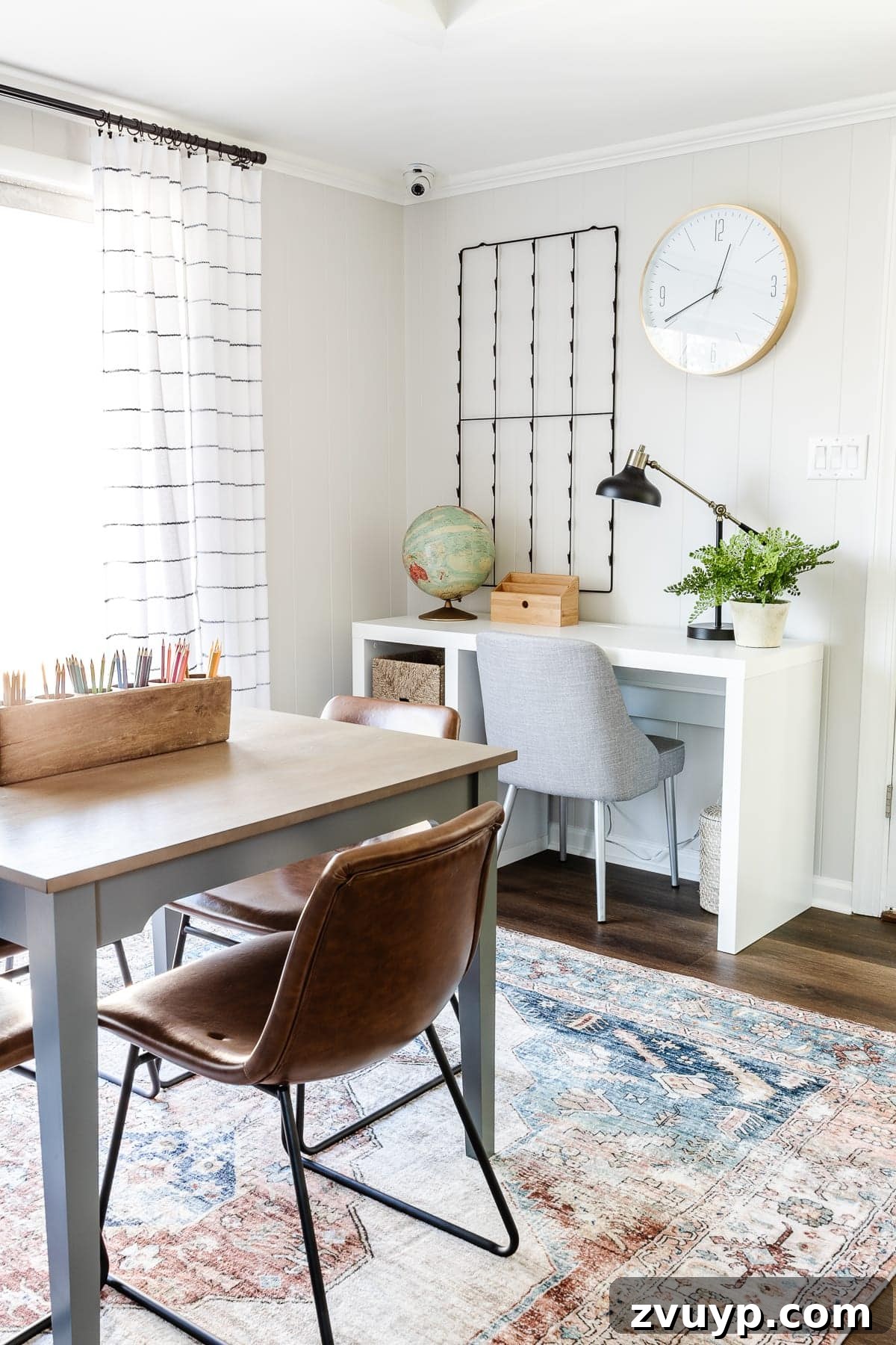 From Drab to Dream Den: Our Rec Room's Big Reveal 20 White desk with storage and a desk lamp in the craft area