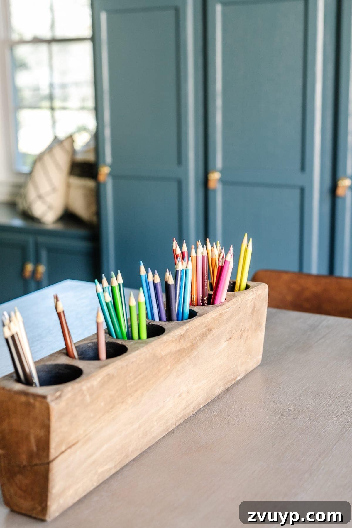 From Drab to Dream Den: Our Rec Room's Big Reveal 23 Antique sugar mold filled with colorful pencils on the craft table