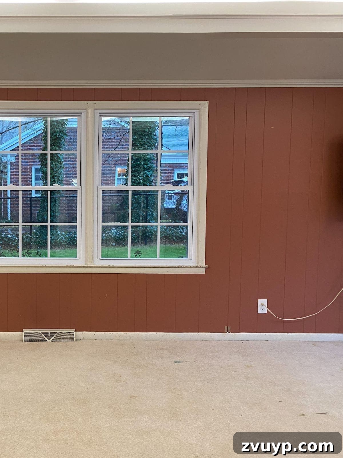 From Drab to Dream Den: Our Rec Room's Big Reveal 5 Feature wall with custom built-in cabinets painted in Benjamin Moore Newburg Green