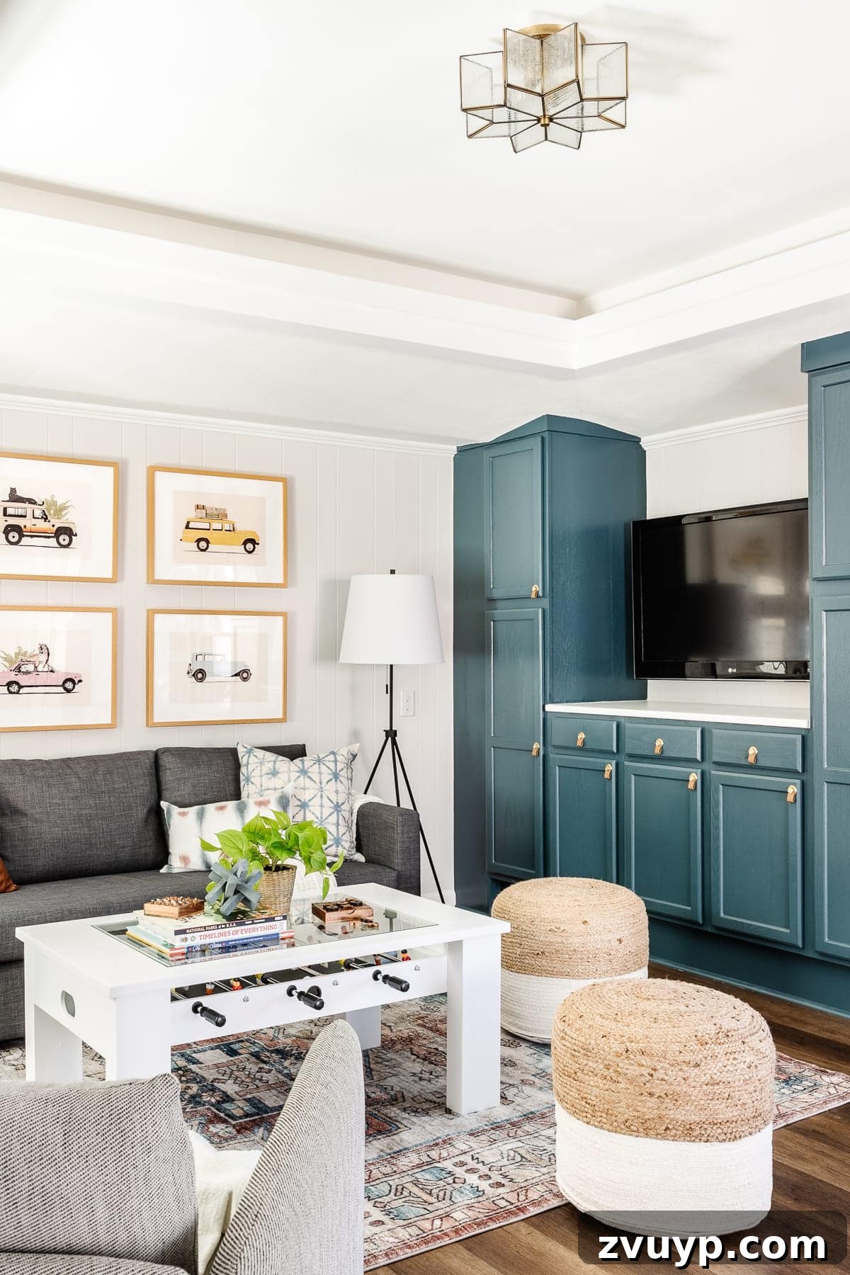 From Drab to Dream Den: Our Rec Room's Big Reveal 8 Cozy living area in the rec room with a large sleeper sofa and eclectic decor