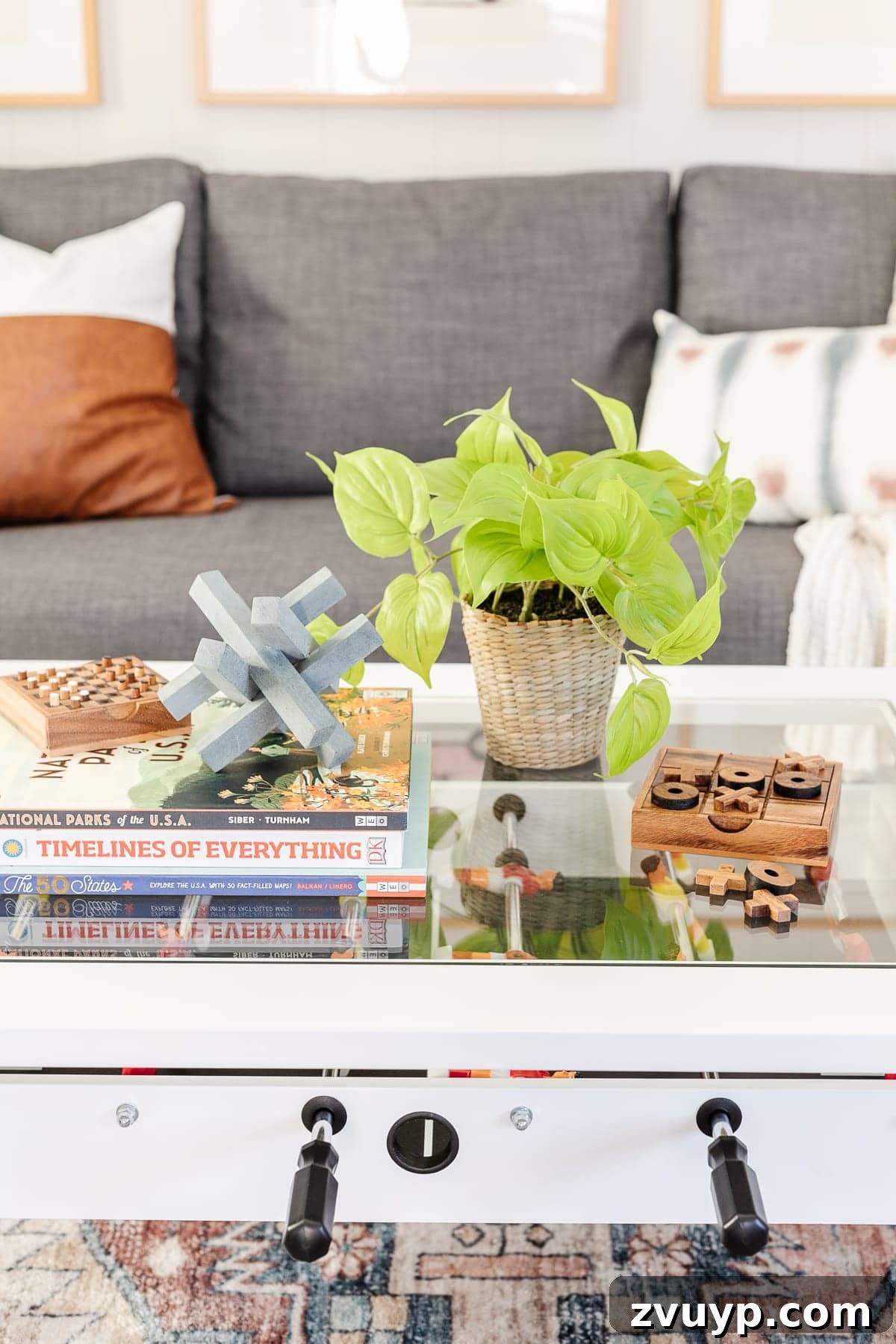 From Drab to Dream Den: Our Rec Room's Big Reveal 10 Close-up of foosball coffee table with styled decor