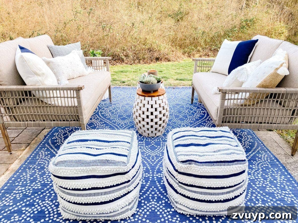 Budget-Friendly Backyard Oasis 10 outdoor poufs and rug covering a small patio