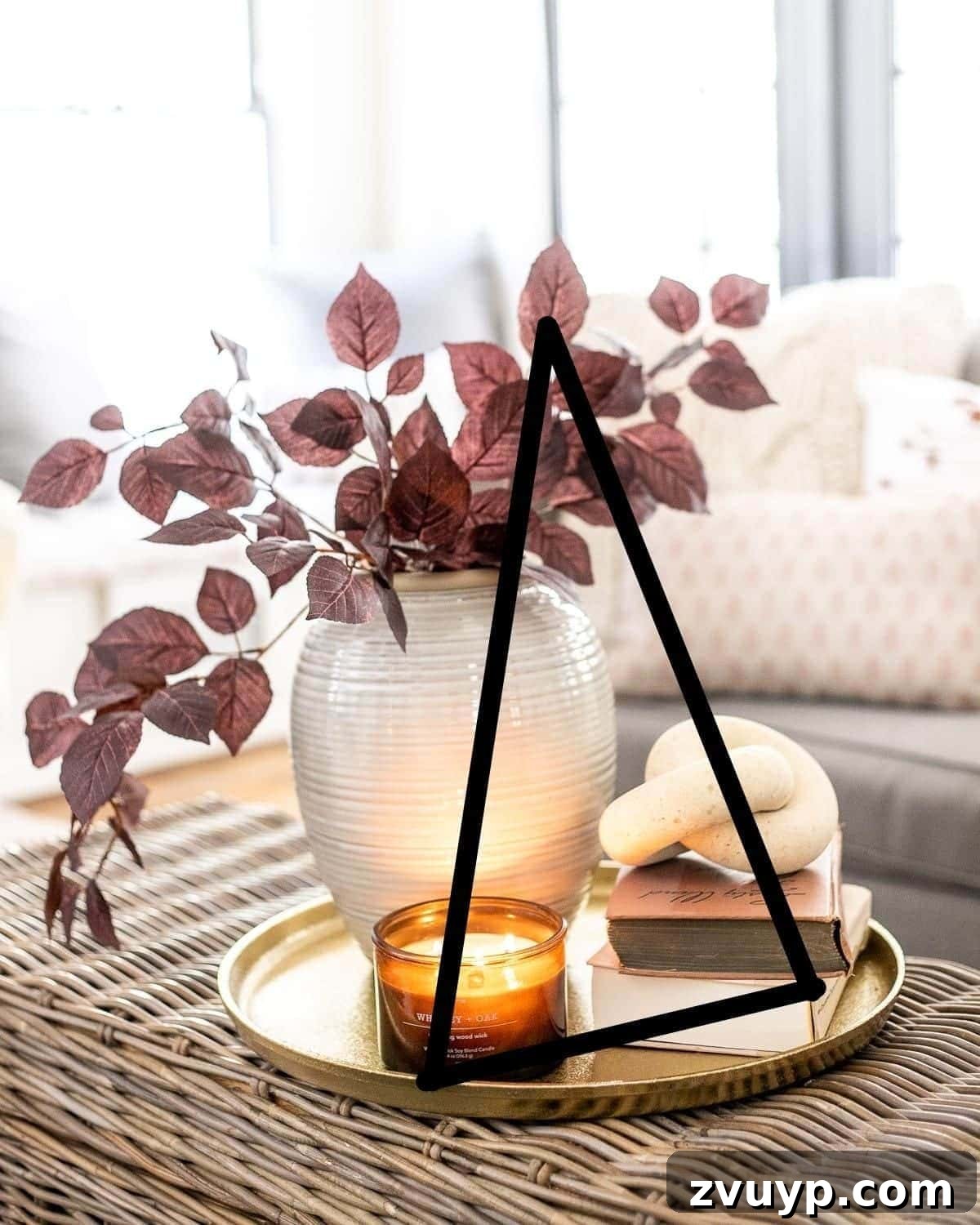 Simple Steps to a Stunning Coffee Table 10 The decorator's triangle principle applied to a coffee table vignette for balanced styling