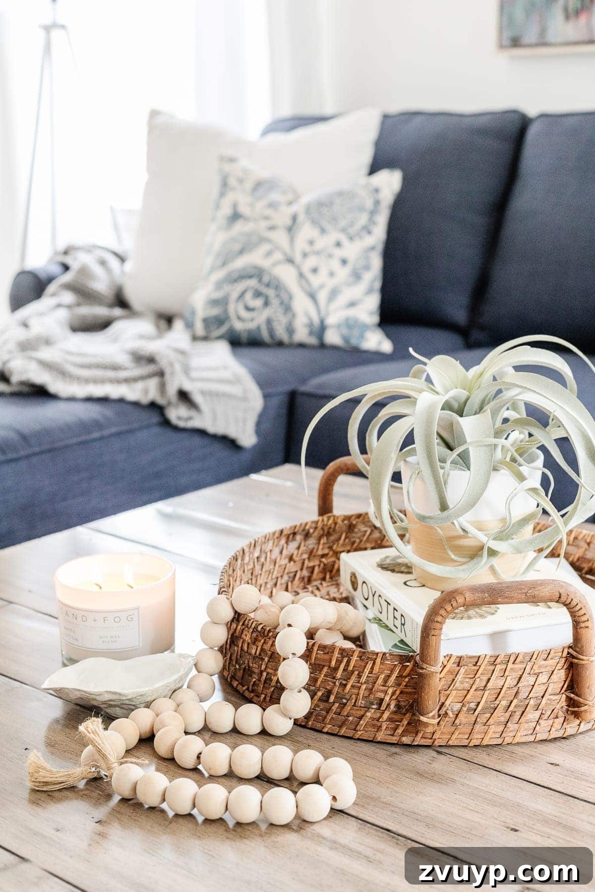 Simple Steps to a Stunning Coffee Table 14 Coastal style coffee table ideas featuring a rattan tray, oyster shell, and beach-themed books